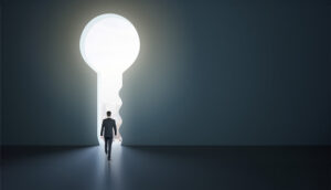 Back view of businessman standing in abstract key opening in wall with bright light and mock up place. Solution and decision concept