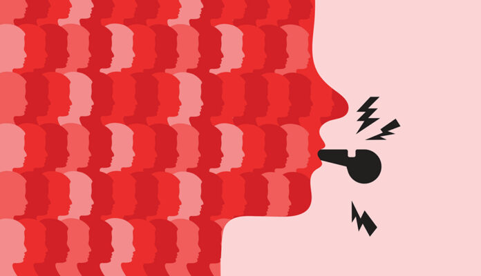 Flat illustration of the profile of a face (comprised of a pattern of multiple faces in three shades of red) blowing a black whistle, with little black lightning bolts indicating sound